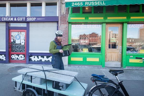 Jack VanDyke delivers microgreens to Russell Street Deli in Eastern Market