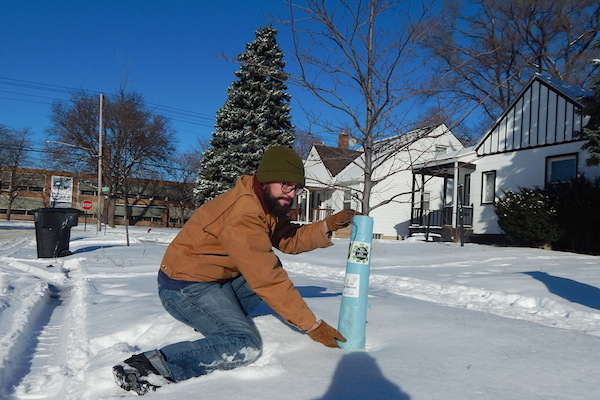 Michael Madej at recently planted tree in Cody-Rouge neighborhood