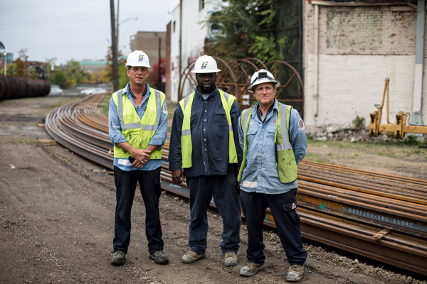 John Dix, Michael Williams, and Mitch Wozniak, skilled tradesmen working on M-1