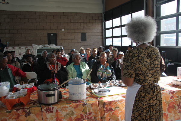 Vazilyn Poinsetta gives a cooking demonstration as a part of Senior Market Days.