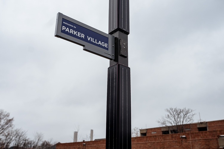 Sign on a solar street light in Parker Village