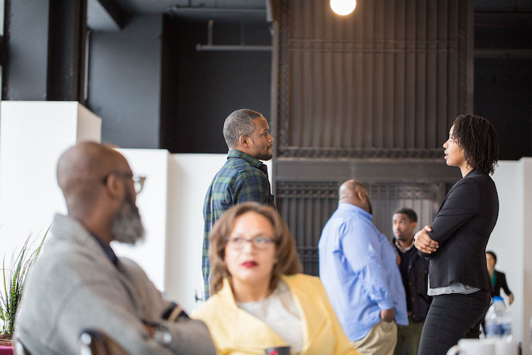 Members of the 2018 Equitable Development Initiative cohort chat at a training session