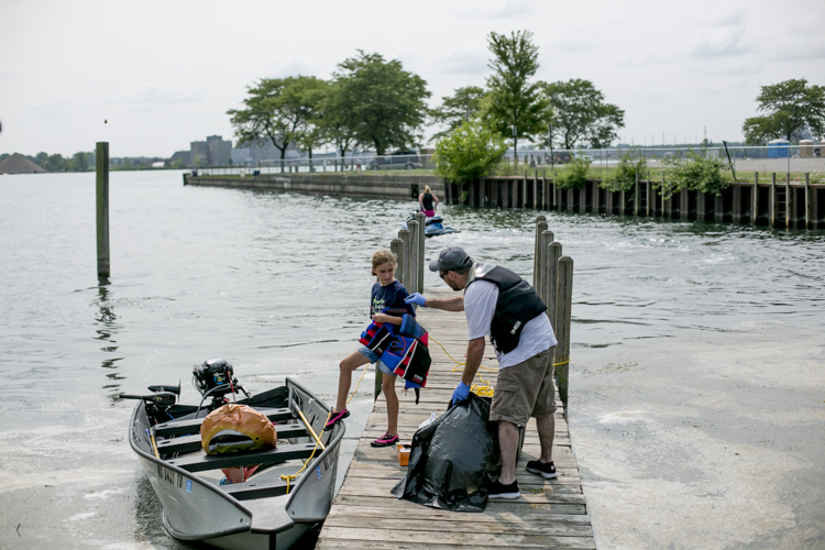 Unloading the boat after a trash fishing outing