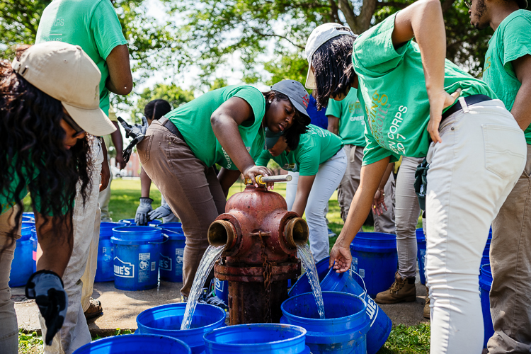 Green Corps work crew fills buckets