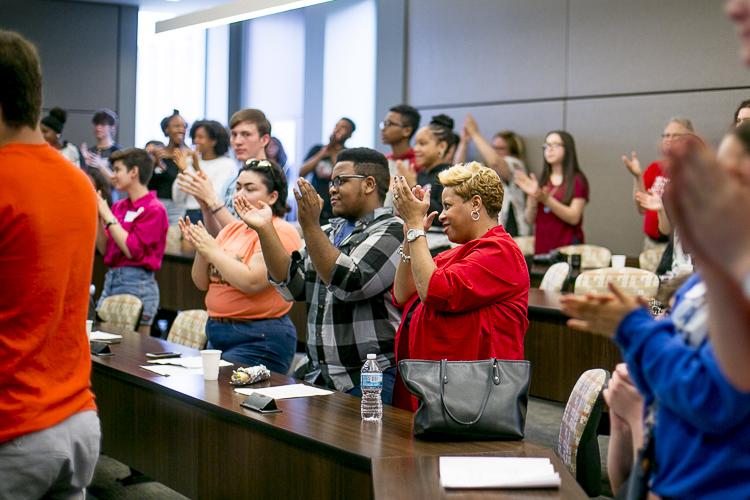 People applaud for the Mosaic Youth Theater