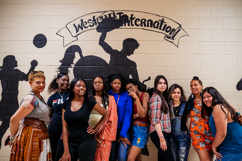Students at Western International with mentors Sabrina Nelson (left) and jessica Care moore (second from right)