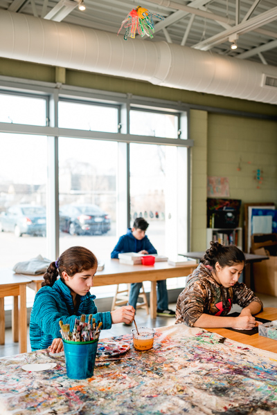 Students Naomi Contreras and Dailiany Velasquez, working on art projects at The SPOT