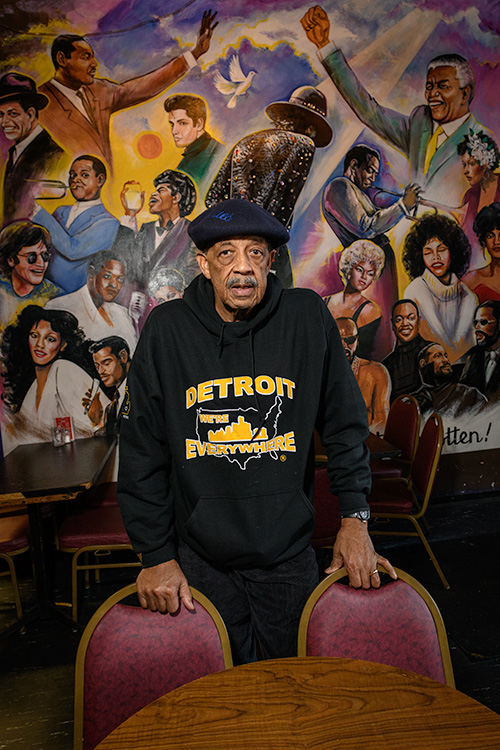 Dearing in front of the Marketplace's mural dedicated to black history in Detroit