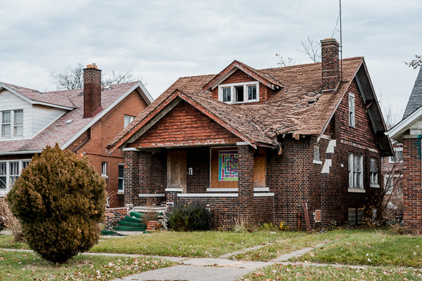 A boarded up home on Birwood Street