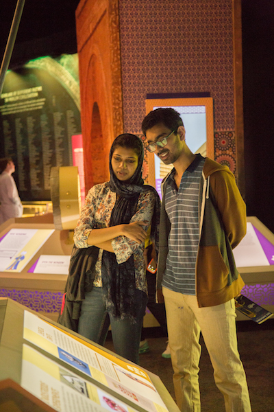 Visitors look at an exhibit from "1001 Inventions"