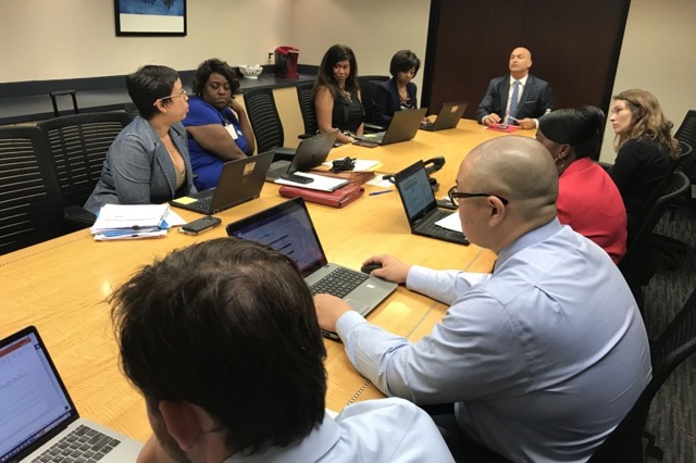 Detroit schools Superintendent Nikolai Vitti leads a meeting of advisers in a conference room adjacent to his office in Detroit's Fisher Building in August 2017