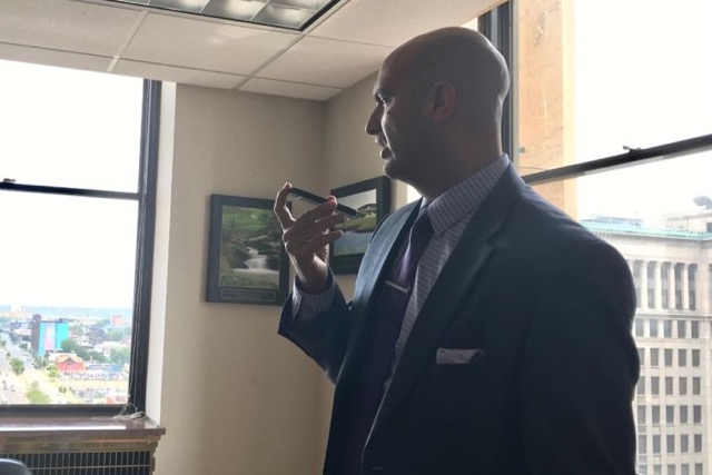 Detroit schools Superintendent Nikolai Vitti takes a call in his office
