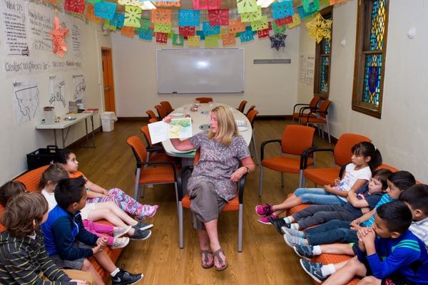 Science teacher Dianne O'Connor reads from a storybook at Brilliant Detroit
