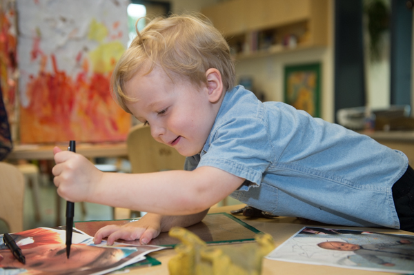 Neil Akers, 3, draws at the UM Dearborn Early Childhood Education Center