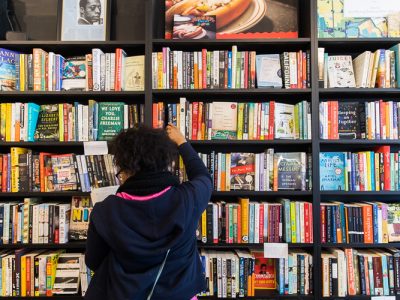 A River Rouge student browses the fiction section at Pages Bookshop