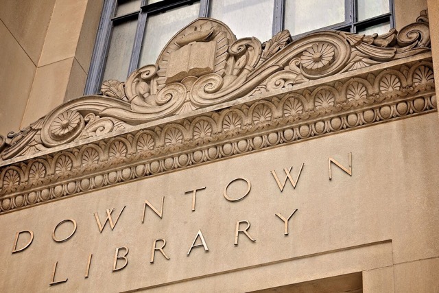 Corrado Parducci's details above the door at the Skillman Branch, Detroit's Downtown Library, showing a lamp of knowledge