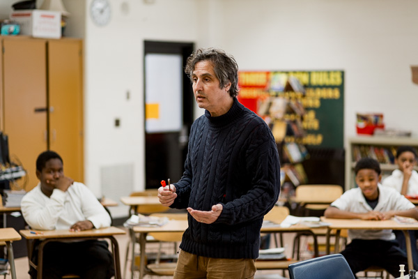 Teaching artist Peter Markus in a classroom at Marcus Garvey Academy