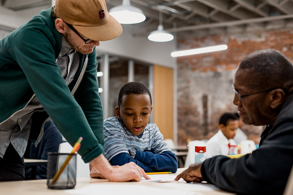 Student and tutors at the first day of tutoring at 826's Eastern Market location