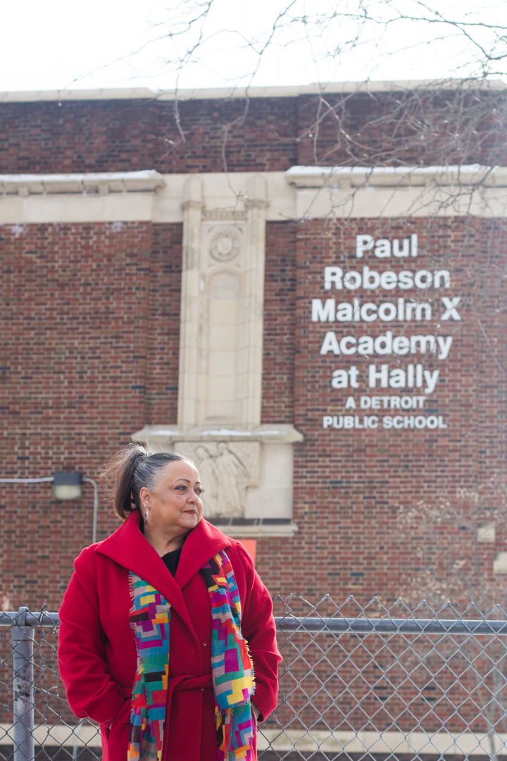 Cheryl Kearny in front of her old school, now the Paul Robeson/Malcolm X Academy