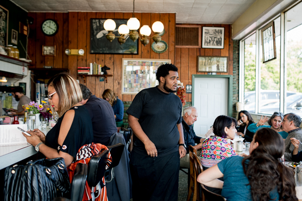 Deonte Lucas, a server at Rose's Fine Foods