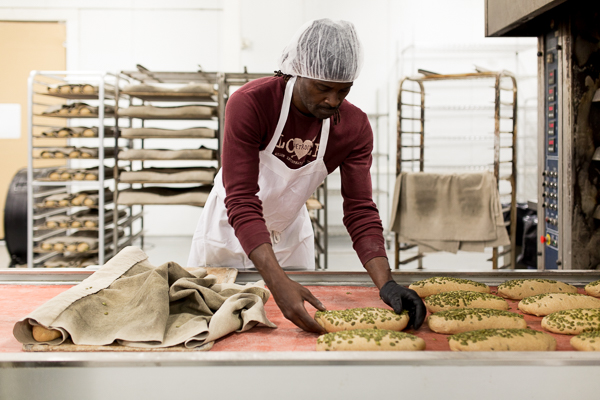 Production manager, Curtis Wooten, preparing pumpkin beer bread for baking. He has been working at Avalon for 17 years.