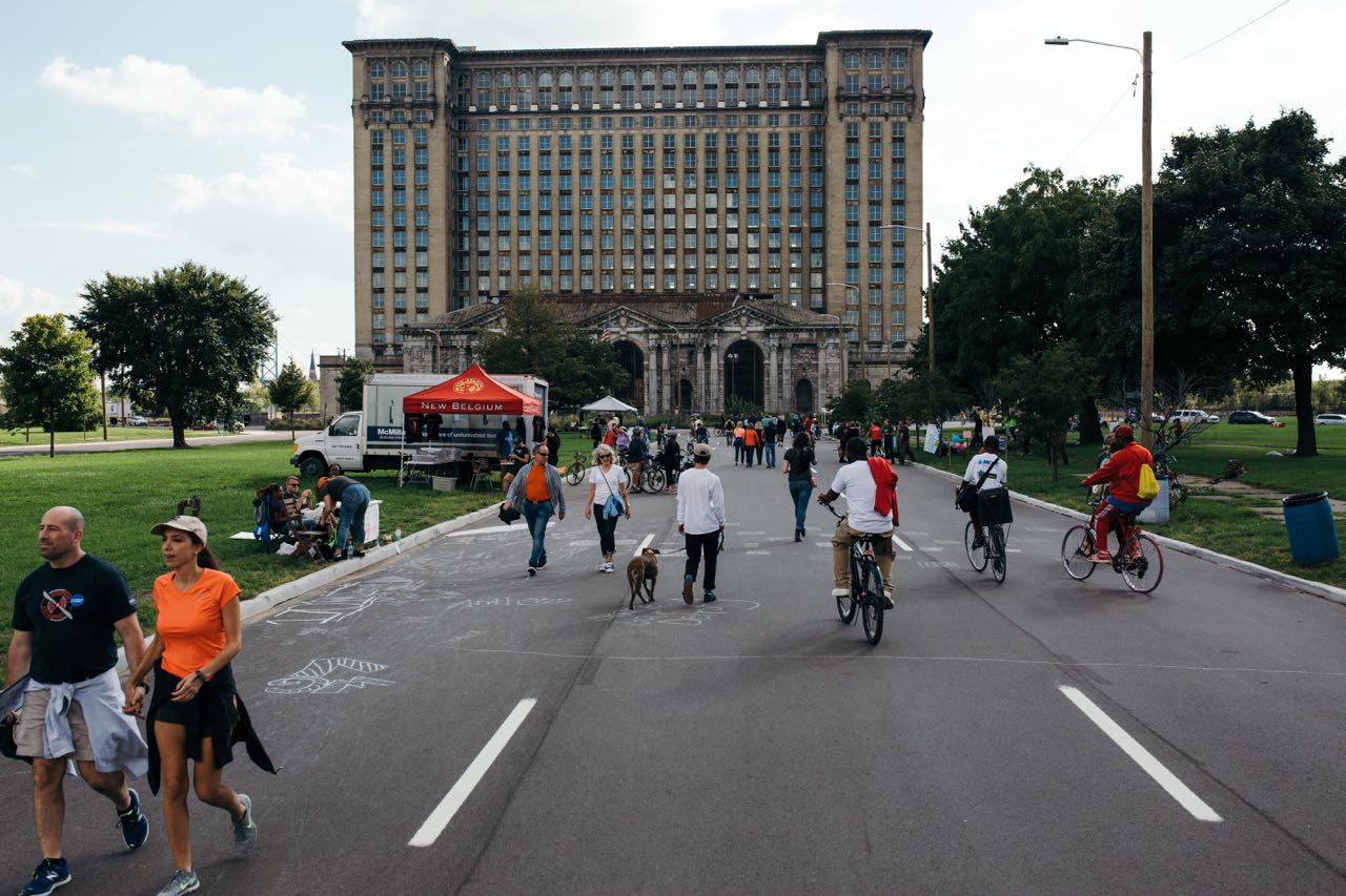 Pedestrians and bikers outside Michigan Central Station
