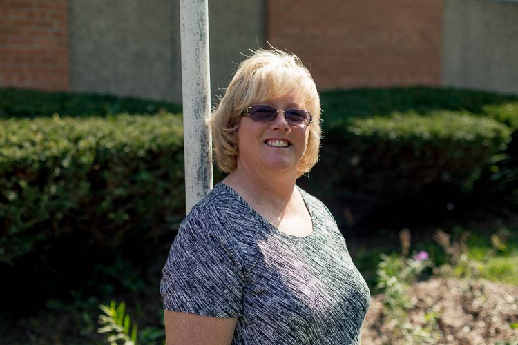 Cyndi Ross at the rain garden at Grace Church of Nazarene on Hoover. Photo by Nick Hagen.