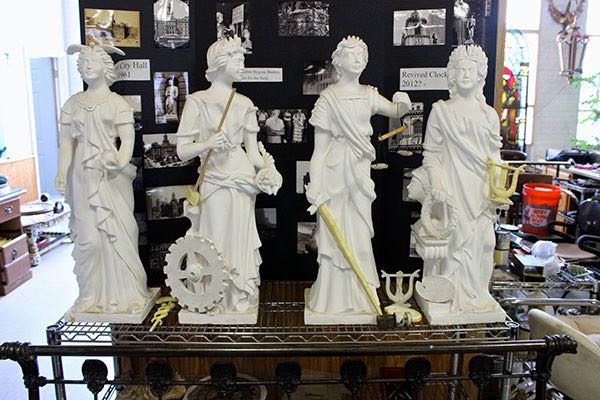 Nielbock's replicas of the Four Virtues statues that once adorned the clock tower. The head and shoulders of the originals each stood as tall as a man