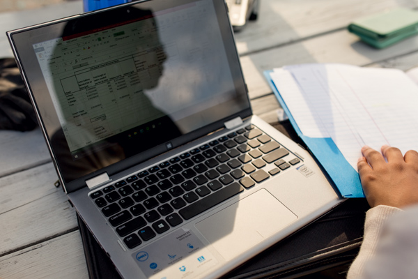 Nada Alhamdi entering data into her spreadsheet