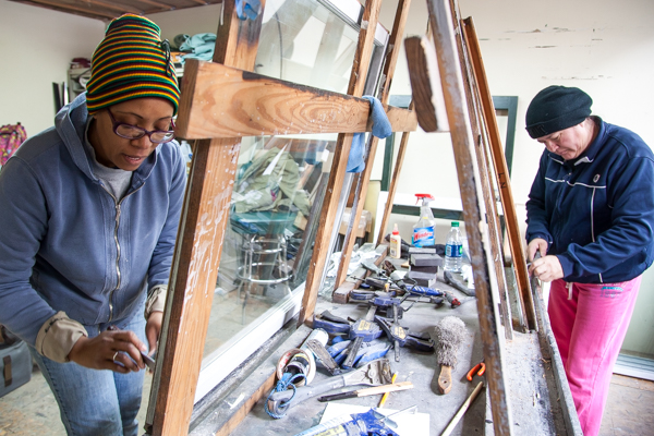Guisa Suttle and Maria Fernandez glazzing and fitting glass at Turner Restoration's workshop