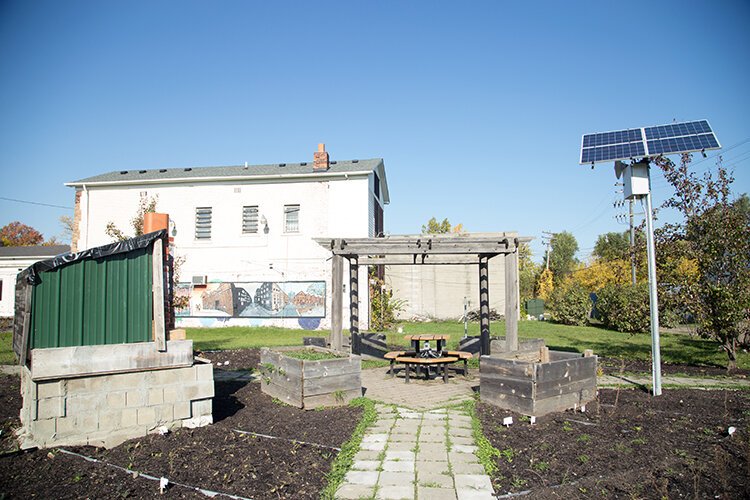 Oakland Avenue Garden and Greenhouse shows off some of the solar panels installed by Ryter Cooperative Industries.
