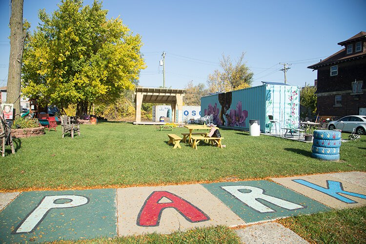 Solar panels, mounted on a shipping container, help power Avalon Village in Highland Park.