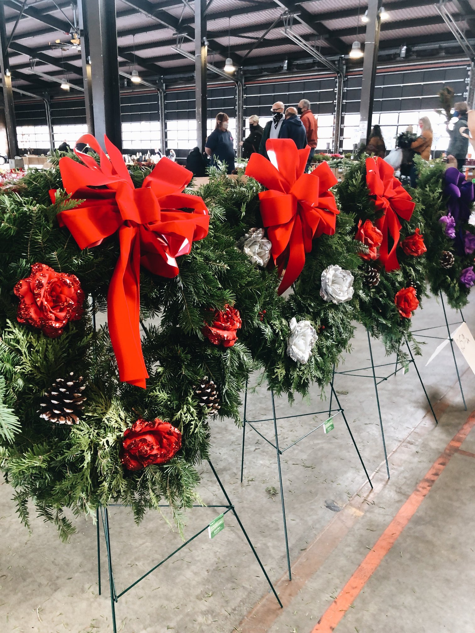 Pick up provisions, gifts, and some festive holiday decor like these wreaths at Eastern Market.