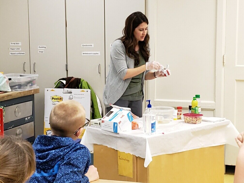Nutrition Educator Cristal Moyer leads a healthy snack demo with students.