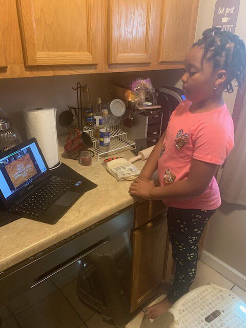 Brooklyn Birthwright watches a cooking lesson via Zoom.
