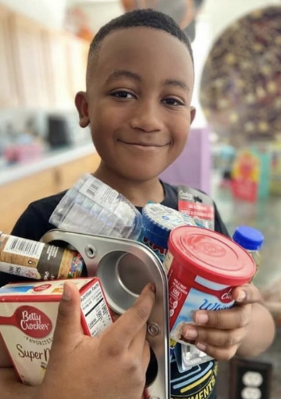 Essais Owens, one of Camp Dinner Table's participants. His mother reports that they now have turned Friday into family cooking time.