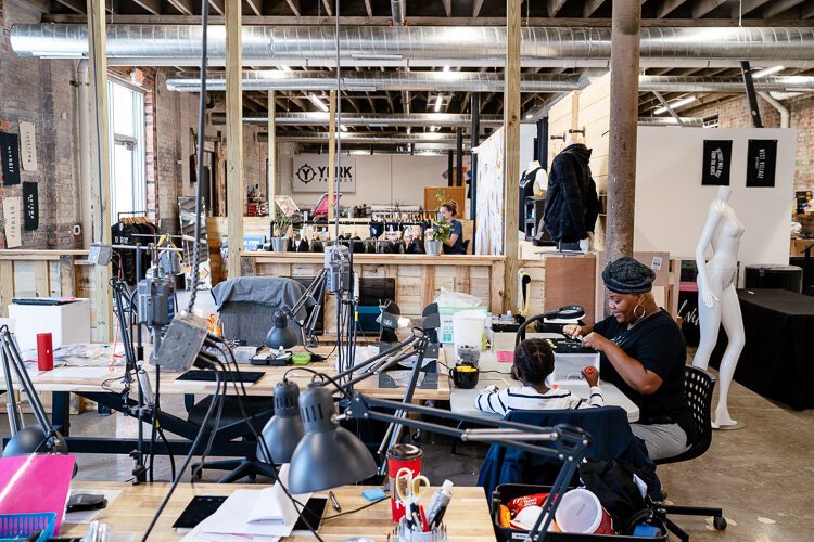 Through art, the women of Rebel Nell design jewelry and other accessories from fallen graffiti and iconic Detroit landmarks. Photo by Nick Hagen.