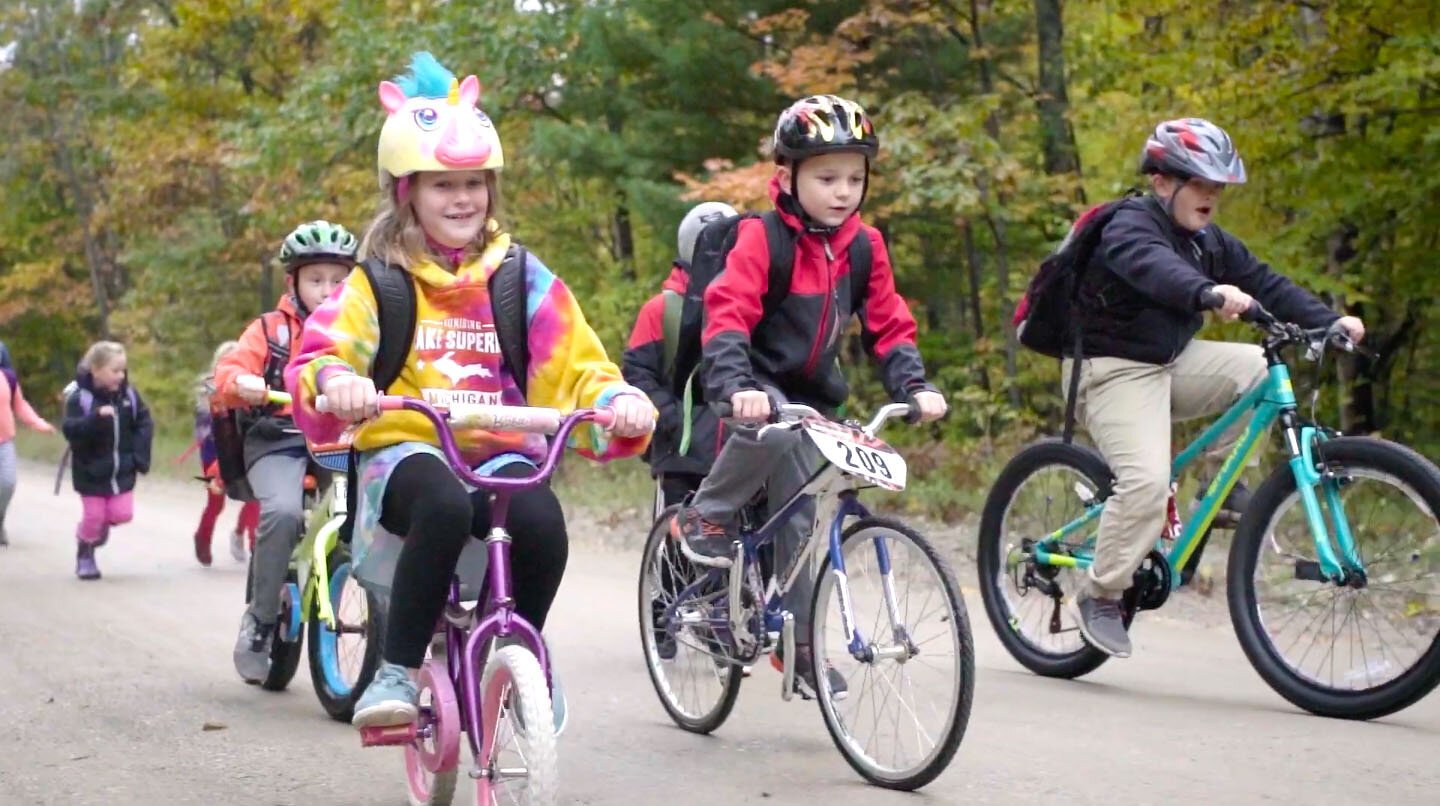 Kids ride bikes in Traverse City.