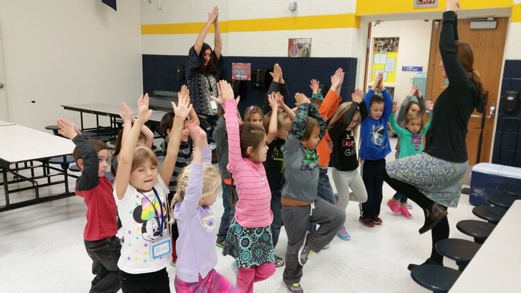 Students participate in a fitness activity in class.