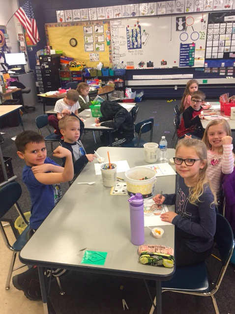 Students taste a crunchy yogurt parfait in a SPLASH/Nutrition session at Beadle Lake Elementary in Battle Creek.