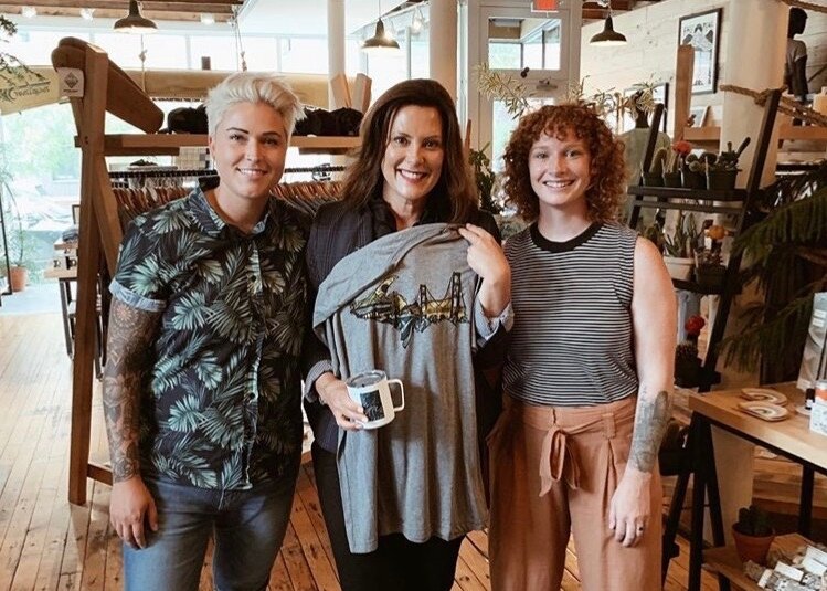 Erica Lang, Governor Whitmer and Kelly McPhee inside Woosah Outfitters.
