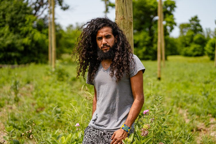 Antonio Rafael from southwest Detroit has always had a penchant for painting water towers, with the most well-known message being "Free the Water" on a Highland Park water tower. Photo by Nick Hagen.