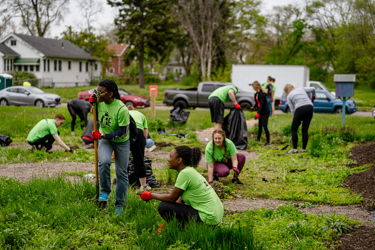 Volunteers from Life Remodeled help out at the Dexter Linwood Cordon community gardens. Photo by Nick Hagen.
