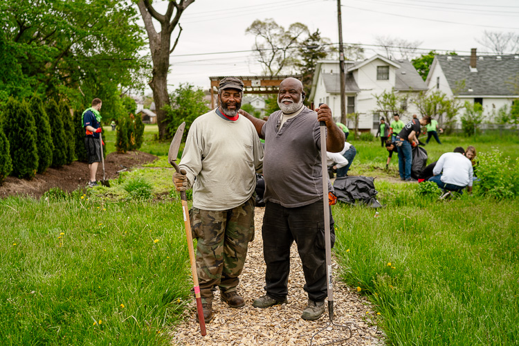 Ron Matten (left) and partner Mario Halley at Dexter-Linwood Cordon Community Gardens. Photo by Nick Hagen.