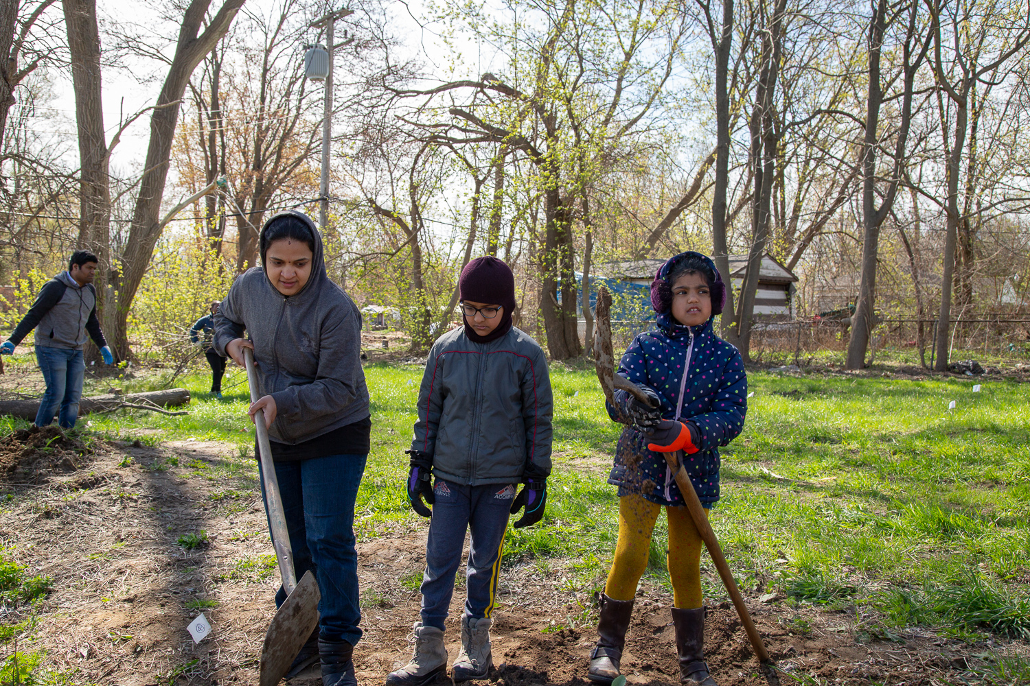 A family volunteers together at a Springboard to Excellence meeting. The program is open to girls of any immigrant background, as well as non-immigrant Black girls. Photo by Lauren Santucci.
