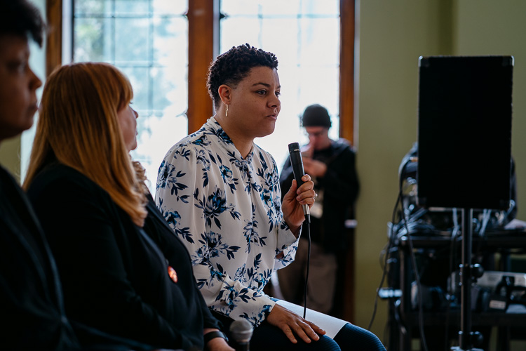 Tosha Tabron, pictured with microphone.