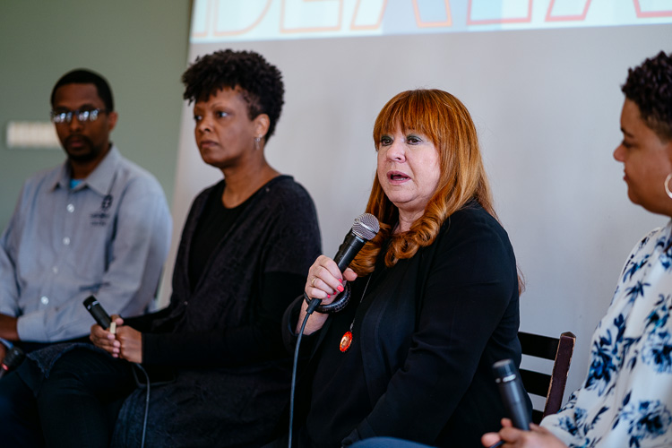 Sheila Cockrel, pictured speaking with microphone.