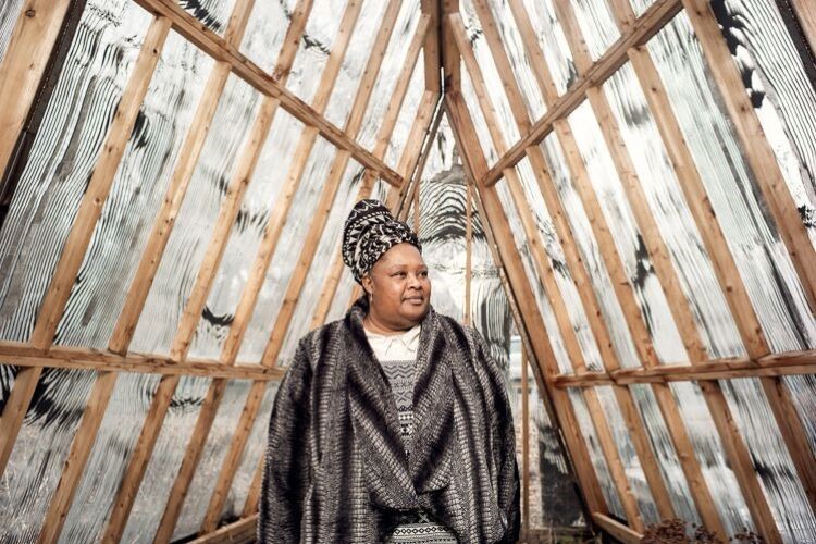 Tammy Black photographed inside the Greenhouse at Community Empowerment Garden.