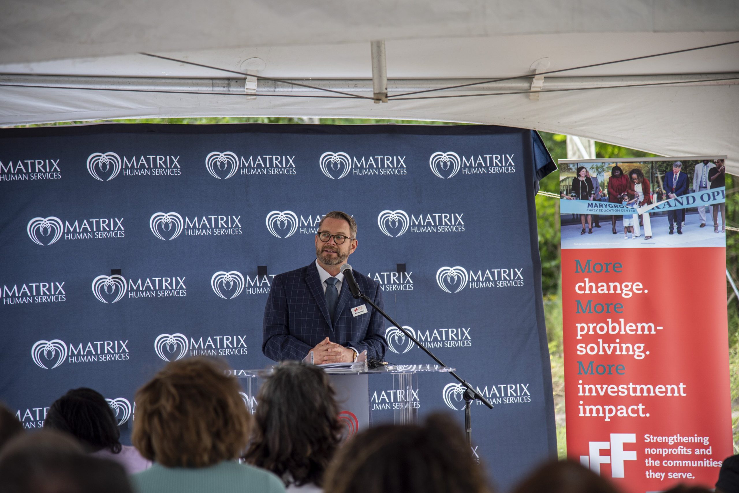 IFF President of Core Business Solutions, Kirby Burkholder, speaks about the CDFI's commitment to neighborhoods in the Eastside of Detroit, at the McClellan Early Childhood Center's ribbon-cutting ceremony.
