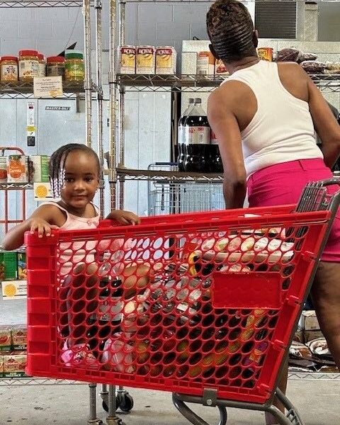 Grandma B reads the SWAP signs on the she helping her choose the healthiest food